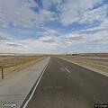 Truck with blown tire scattering debris on I-80