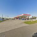 Two vehicles collide in gas station parking lot