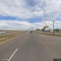 Person sick near highway intersection in Fort Lupton