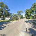 Person experiencing back pain in Lockport