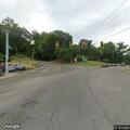 Person slumped over in vehicle at intersection