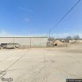 Masked man opens doors of truck and trailer