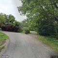 Male slumped over car hood in Lockport Township