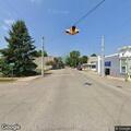Reckless silver minivan driving on Main Street