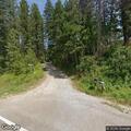 Woman in white Chevy tries to enter rural property