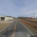 Car stuck on railroad tracks near Red Road