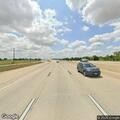 White pickup truck on shoulder of US 290 before Becker