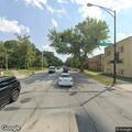Person slumped over wheel in SUV at busy intersection
