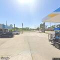 Officer locates man with active warrant at gas station
