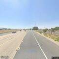 Dark SUV stopped on blind curve of I-15