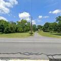 Man running in road and opening mailboxes