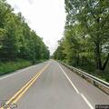 Car hits guardrail and is left empty on roadway