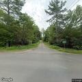 Tree in power lines causing small roadside fire