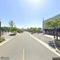 Person with respiratory issue near bus stop on Main St