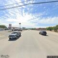 Pickup truck and trailer blocking roadway
