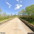 Brush fire under bridge near East Grange Road