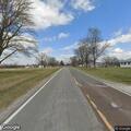 Man walking in roadway in underwear