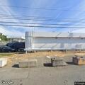 Strong natural gas odor near gas station parking lot