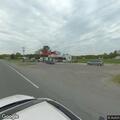 Brush fire found extinguished in roadside ditch