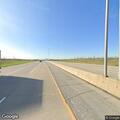 Pedestrian reported standing under highway sign