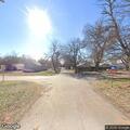Controlled burn of tree limbs on East Fifth Street