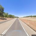 Driver throws bottle and rock at passing vehicle