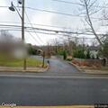 Motorcycle crash in front of residence in Locust Valley