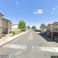 Two men in physical fight near housing complex