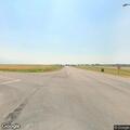 Truck off highway and two women fighting on roadside