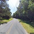 Truck knocks down power pole, power lines on road