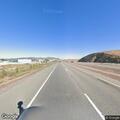 Person experiencing chest pain in silver Mazda on Highway 58