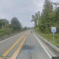 Vehicle crashes into ditch filling with water