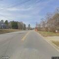 Person with back pain at Oakdale Mill Road intersection