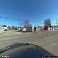 Person dumping gasoline from black Ford Edge