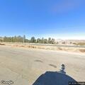 Box trailer missing two tires on Frontage Road