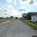 Person standing in roadway on N 12th Street