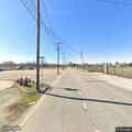 Man lying on roadside past railroad tracks in Montgomery
