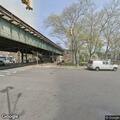 Homeless person lying at Parkchester station