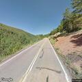 Vehicle with flat tire on Pikes Peak Highway