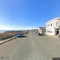 Older man walking in and out of Mendocino roadway