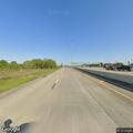 Stalled vehicle on outbound shoulder of Gulf Freeway