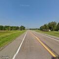 Older red truck runs stop sign on Highway 71
