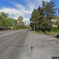 Person slumped over inside a cream Lexus SUV on Smithers Ave