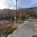 Tractor-trailer stuck on one-lane bridge on US 64