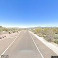 Motorcycle and car crash blocks Carefree roadway