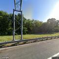 Disabled box truck on I-93 ramp, items thrown nearby