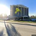 Person experiencing abdominal pain at hotel lobby