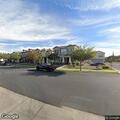 Man with weapon near block wall in Mesa