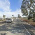 Person slumped over wheel in gray sedan on Highway 99