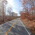 Tree partially blocking Route 82 roadway